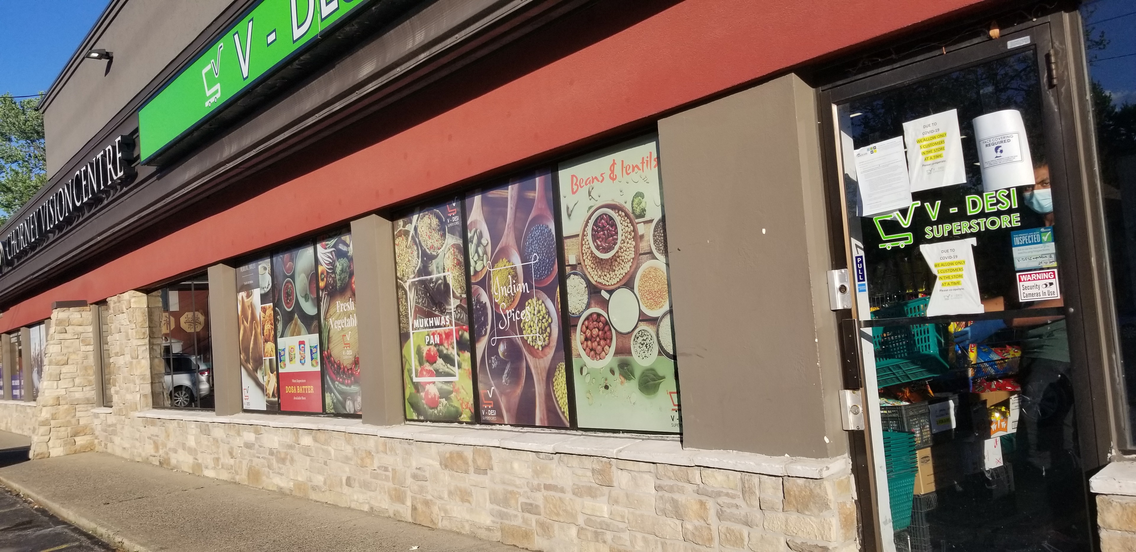 Desi superstore storefront with large format graphics